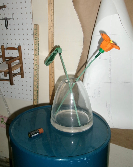 Glass Cone Vase with Lego Flowers in a sewing studio